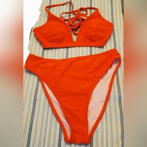 vibrant Red Bikini set Features a strappy top and high-waist Bottoms